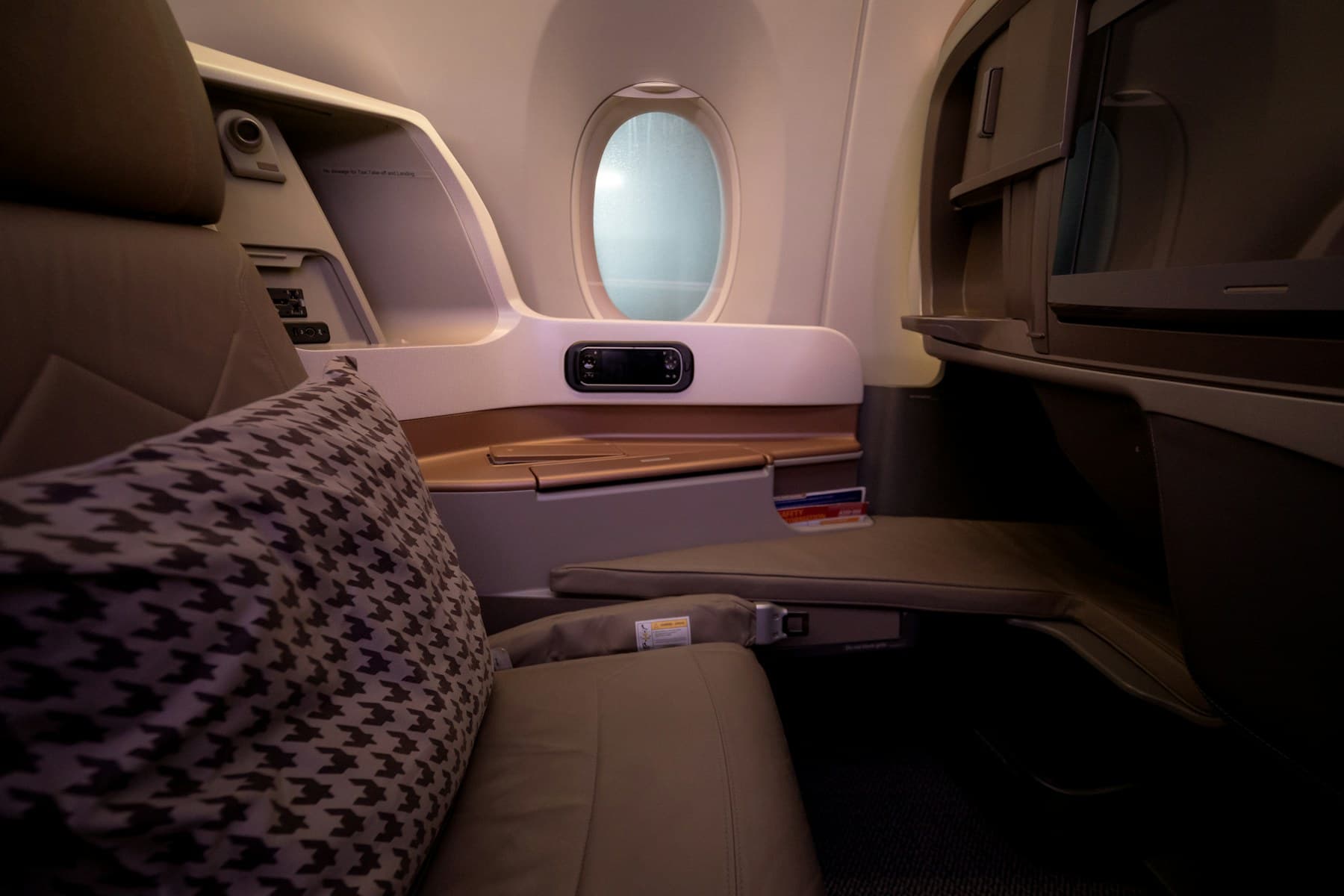 A real premium business-class seat beside an aircraft window